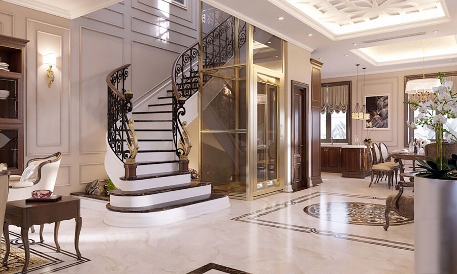 Thang máy lồng kính khung mạ vàng sang trọng